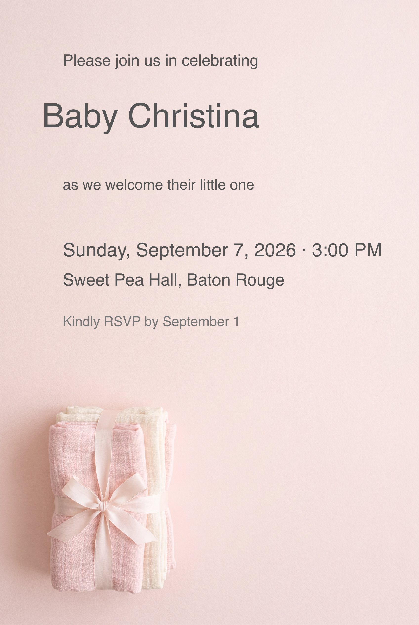 Blush pink baby shower invitation with folded muslin swaddles tied with a satin bow.