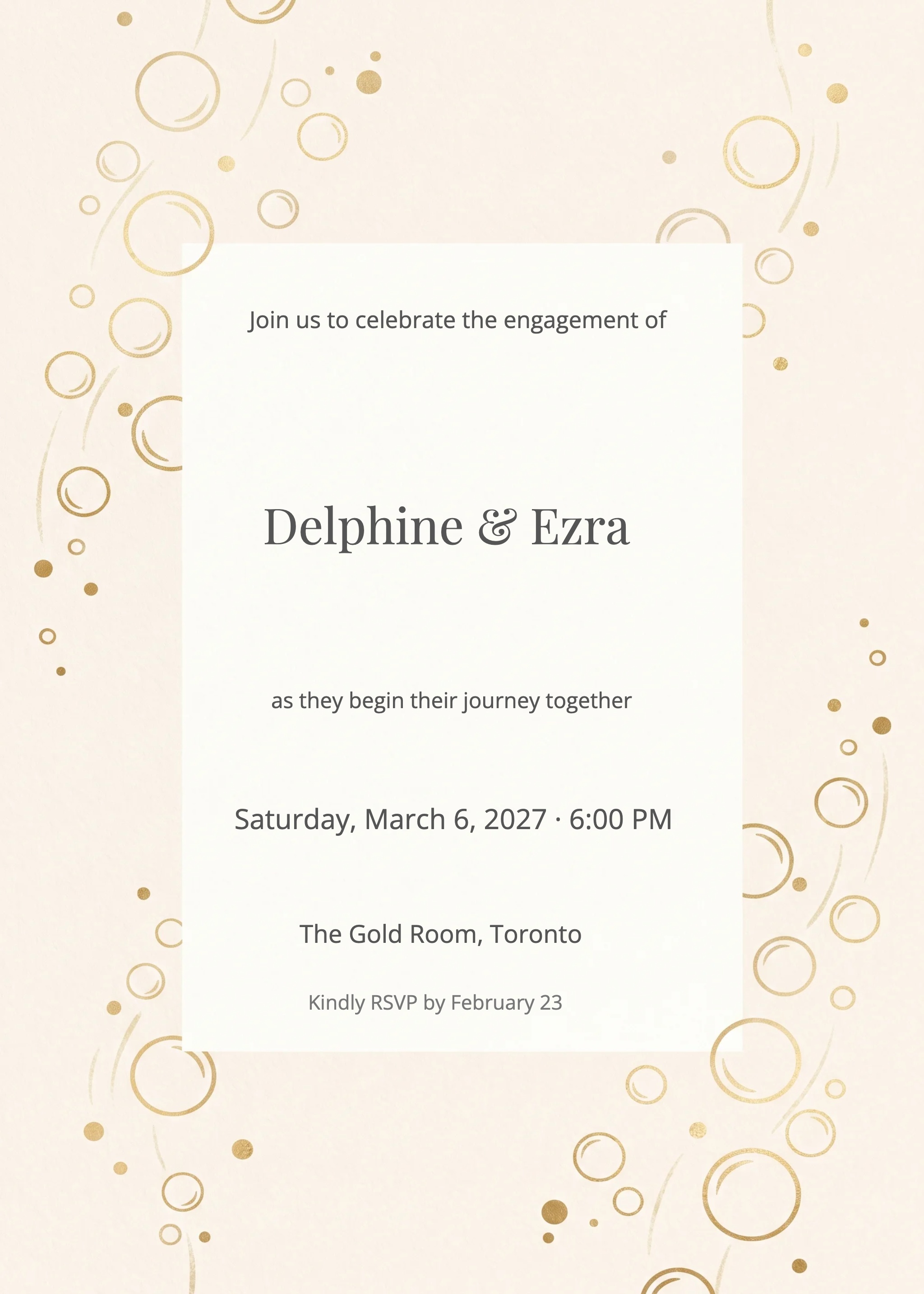 Ivory invitation card with gold champagne bubbles border and serif couple names.